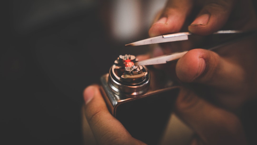 person fixing box mod